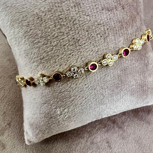 Created in 18 karat yellow gold Rubies 1.60 carats approx. Diamonds 1.50 carats approx. 8 inch length with lobster clasp...