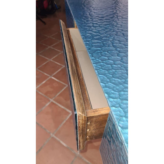 This console table has clean, simple lines, crafted from birch wood. It features three spacious, velvet-lined drawers that...