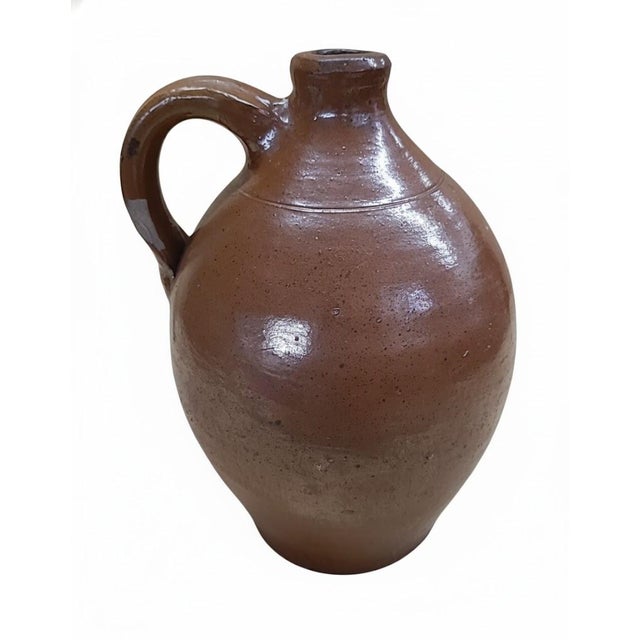 Charming antique American redware whiskey jug, entirely hand-thrown with a warm iron-oxide glaze and classic ovoid body....