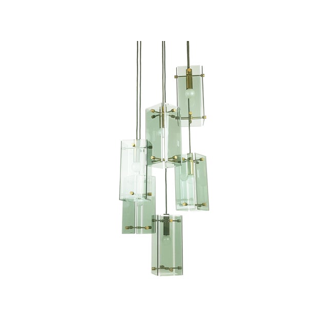 This elegant lamp was produced in Italy around the 1960s. It is composed by 6-lights pendants at different adjustable...