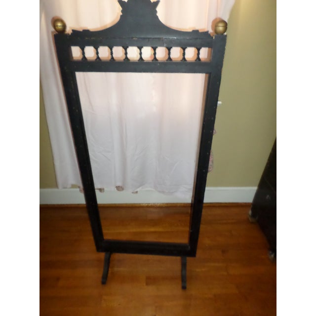 This is a Gorgeous! Antique Victorian Ornate Ebonized With Gold Accents Fire Screen Frame that has small Iron Castors and...