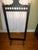This is a Gorgeous! Antique Victorian Ornate Ebonized With Gold Accents Fire Screen Frame that has small Iron Castors and...