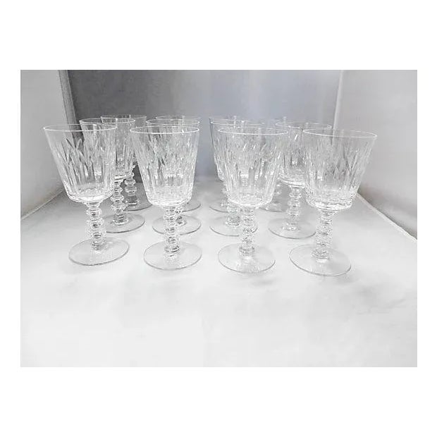 Elegant and simple set of 12 fine crystal sherry glasses. One has little chip on the base.