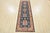 A tribal Kazak runner hand-knotted with an all-wool pile on a cotton foundation. This oriental rug features a row of...