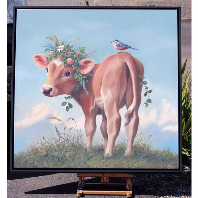 This oil on canvas piece features a charming cow adorned with a floral crown, standing in a lush, grassy landscape. A...
