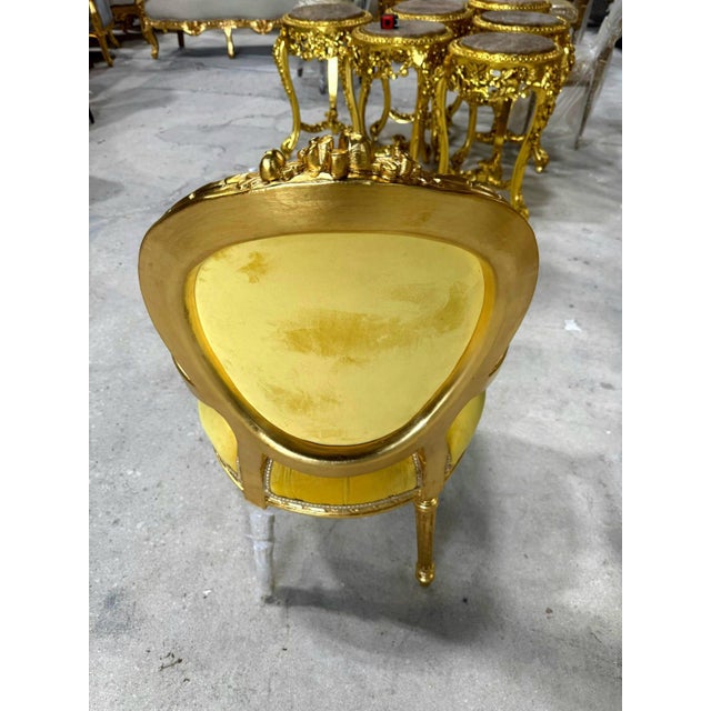 Bring elegance and luxury to your home with this French Rococo-style armchair. Fully refinished with gold leaf, it...