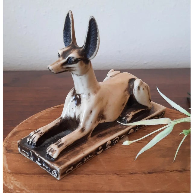 Vintage Anabis dog figurine, one of the ancient gods of Egypt in the form of a dog. This sits on a base. Appears hand...