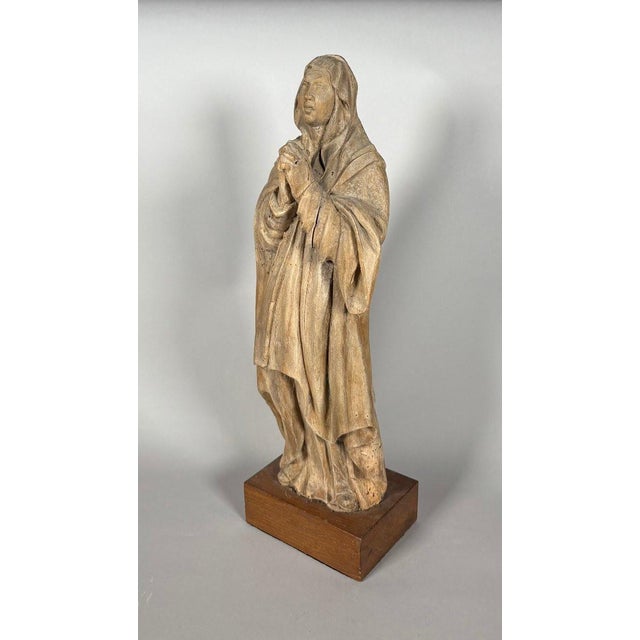 The Virgin Mary in Prayer. Carved wood, traces of polychromy. French work, 16th century. Height 46 cm