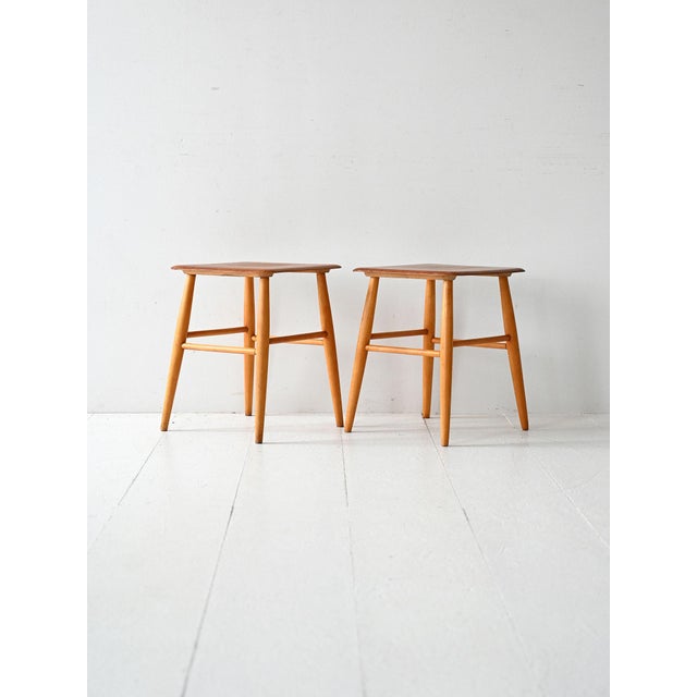 Pair of Fanett stools designed by Ilmari Tapiovaara for Edsbyverken. Beech frame and teak seat. Pair of Fanett stools...