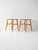 Pair of Fanett stools designed by Ilmari Tapiovaara for Edsbyverken. Beech frame and teak seat. Pair of Fanett stools...
