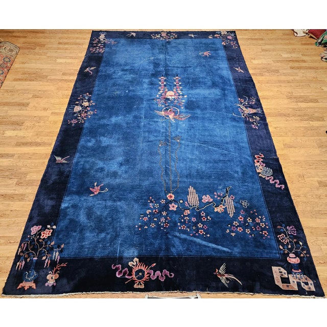 Elegant, rare, and rich in cultural symbolism, this early 20th-century Chinese Art Deco rug features a striking French...