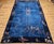 Elegant, rare, and rich in cultural symbolism, this early 20th-century Chinese Art Deco rug features a striking French...