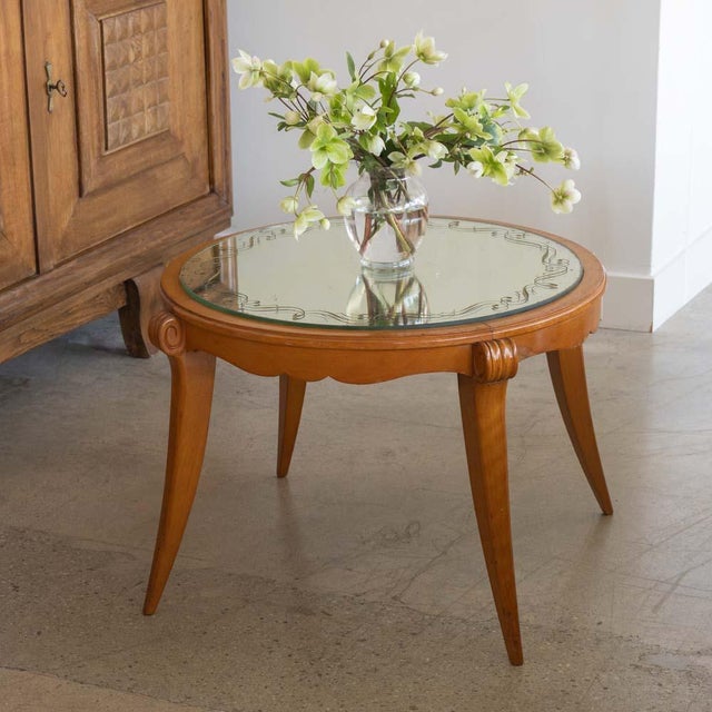 Wonderful beech wood cocktail table with mirror top from France, 1940s. Circular top with original verre églomisé mirror...