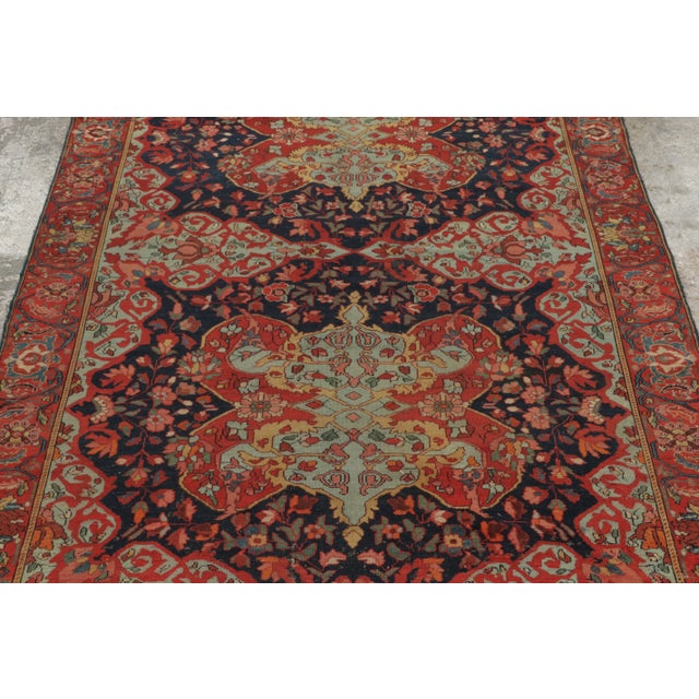 Hand-knotted in wool, this 4x6 Vintage Turkish Anatolian rug, circa 1950–1959, features bold twin geometric medallions set...