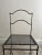 Vintage steel chair from France, c.1950. Handmade and featuring curves to the back, legs and struts and a perforated sheet...