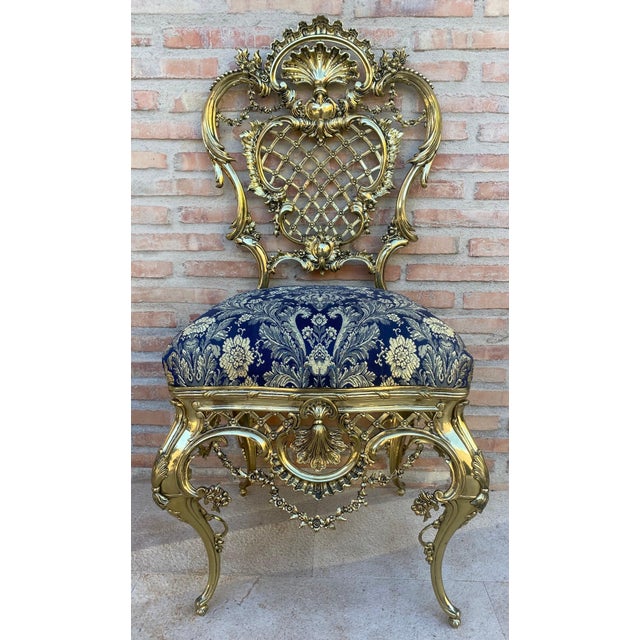This striking Rococo style chair is crafted in finely carved and gilded wood, showcasing an exuberant design inspired by...