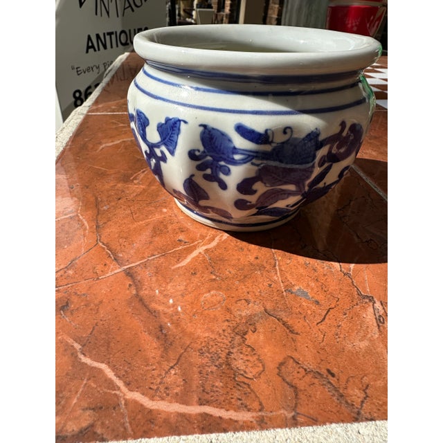 Up for consideration is a beautiful blue and white small vase. This would look lovely in your home and it is a great find...