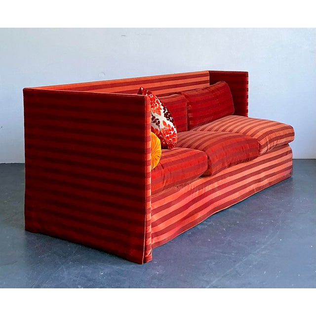 Experience the refined architectural elegance of this vintage John Saladino sofa, a masterclass in high-end postmodern...
