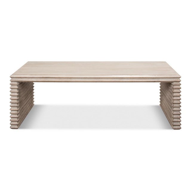 Horizontal boards stack at each end, with wire-brushed grain rising through the stone-gray finish. The top runs over both...