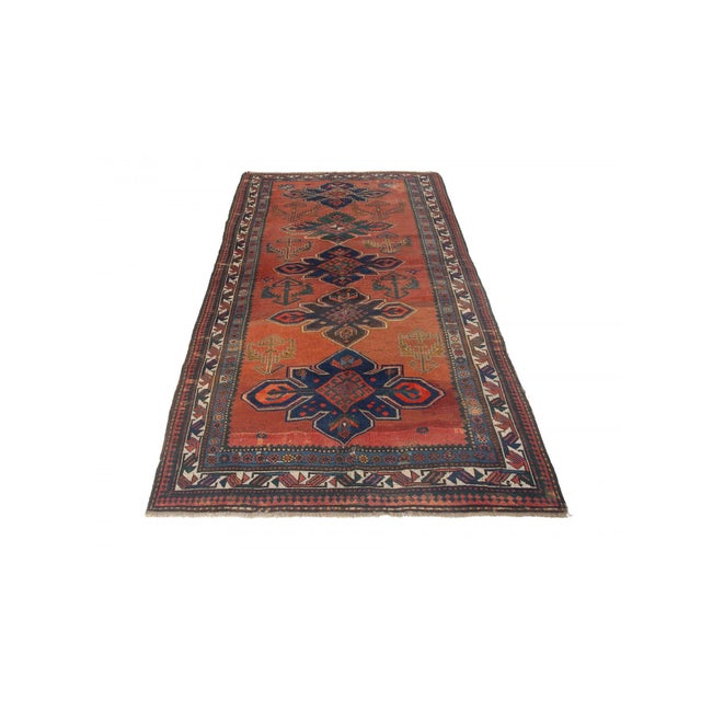 Antique decorative wool handknotted Caucasian rug. Approximately 75-85 years old. In very good condition.