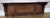 A striking Vintage French coat hanger, beautifully designed with rich oak tones, intricate carved detailing, and an...