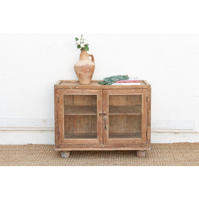 This 37-inch Antique Apothecary Cabinet is a rare survivor from the colonial era of Northern India, offering a perfect...