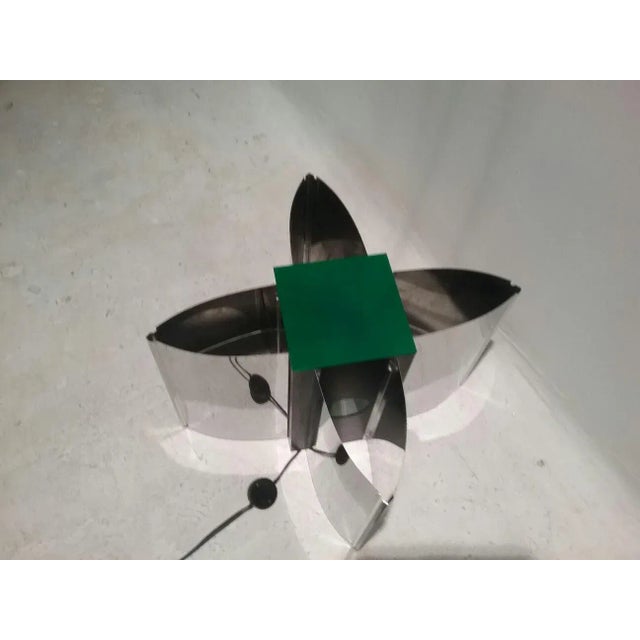 This large Space Age wall lamp from the 70s is made of metal and green plastic. European Plug (up to 250V).The wiring of...