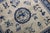 A rare 6 foot square an early 20th century Chinese rug with a graphic Chinese Motif in slate and blue Measures: 6' x 6'1".