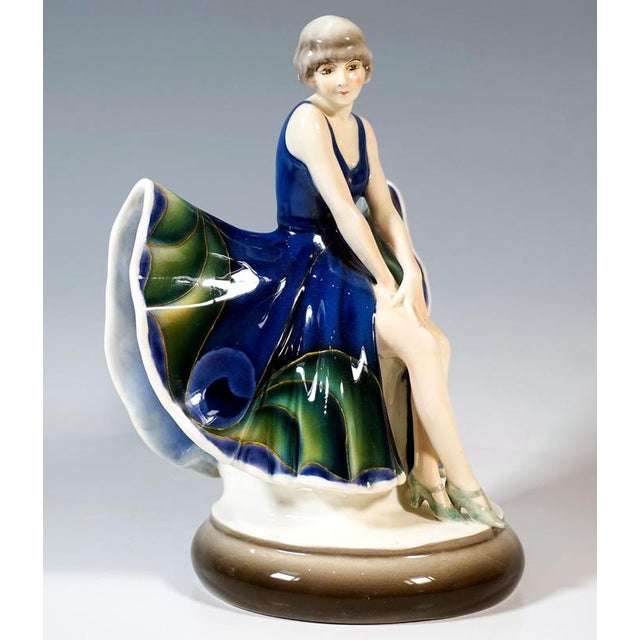 Rare goldscheider ceramic figurine of the 1920s: seated dancer with chin-length curly hair, wearing a plain blue...