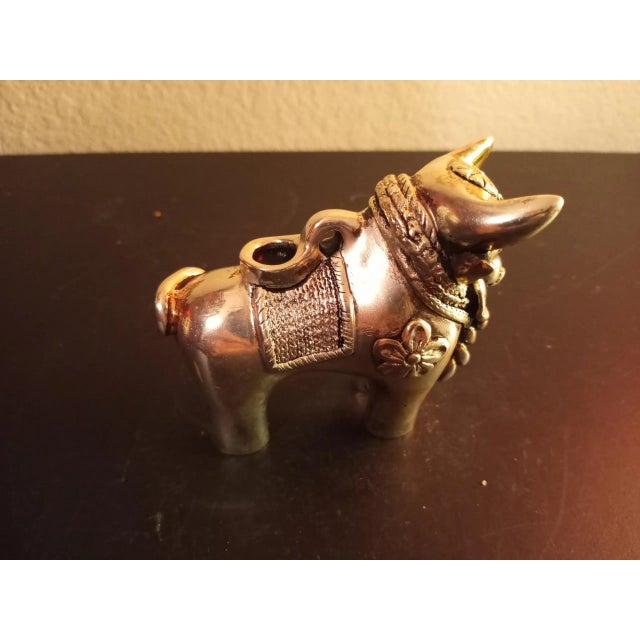 This is a Silverplated 4" Bull Figurine. Procured at auction