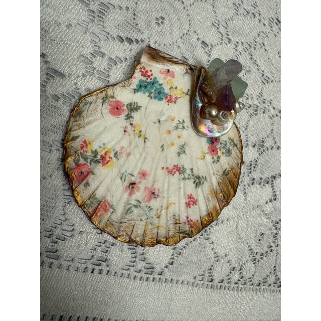 Handcrafted floral seashell trinket tray with assorted seashells, sea glass, opalescent crystals and pearl accents. For...