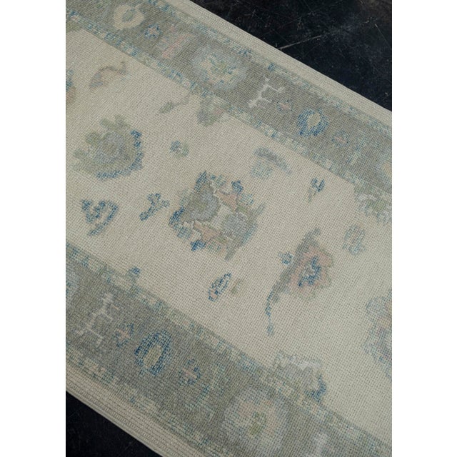 Turkish Oushak Rug Green & Blue Handwoven Wool Rug 3'2" X 6' This 3'2" x 6' Turkish Oushak rug showcases a soft sage green...