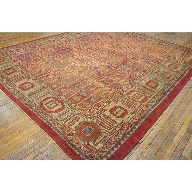 19th Century N.W. Persian Bakshaiesh Carpet ( 10'10" x 13' - 330 x 396 ) The red-rust field supports a slightly...