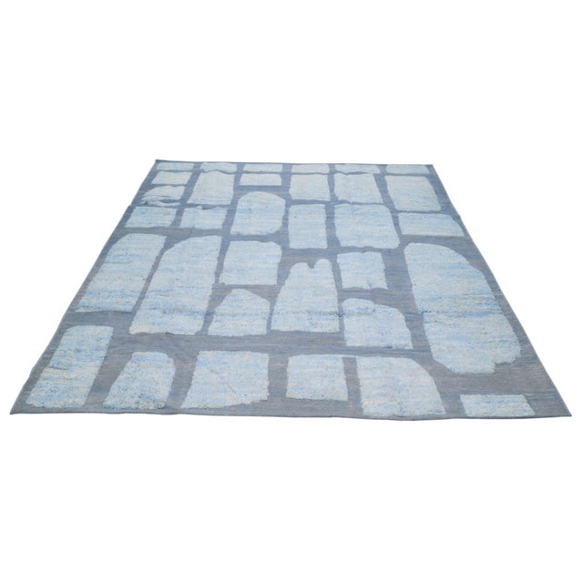 Hand-knotted with care using traditional rug-making techniques, this wool rug blends timeless craftsmanship with a modern...