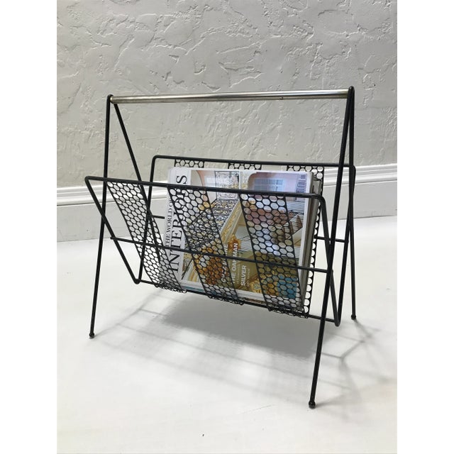 Vintage design nice black magazine holder from the 1960’s. Made of black painted perforated steel on slim black painted...