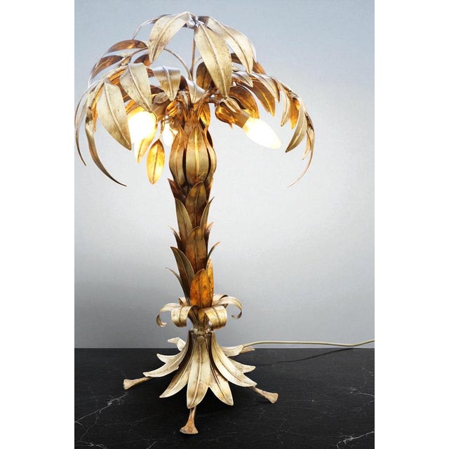 The Hans Kögl Palm Tree table lamp is a unique and luxurious lighting element that brings stylish elegance and exotic...