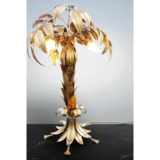 The Hans Kögl Palm Tree table lamp is a unique and luxurious lighting element that brings stylish elegance and exotic...