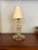 Handcrafted in Murano, Italy during the 1950s, this small elegant table lamp features a stacked column of mould-blown...