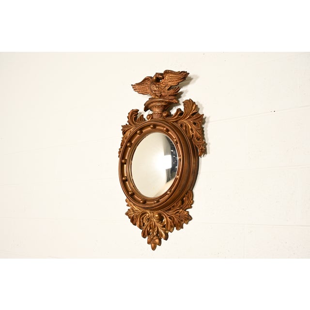 A gorgeous American Federal or Regency style gilt plastic framed convex bullseye eagle wall mirror By Turner Mfg. Co. USA,...