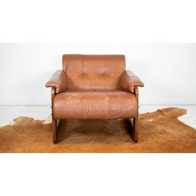 Vintage Attributed to Percival Lafer MP-185 leather and jacaranda lounge chair, circa 1970s. Floating form fitting...
