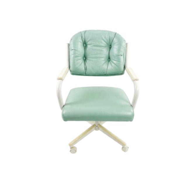 Retro vintage Chromcraft seafoam green rolling dinette chairs featuring a distinctive mid-century modern design....