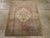 This early 20th century Turkish Oushak rug, measuring 2' 11" x 3' 8", features the soft, atmospheric palette and spacious...