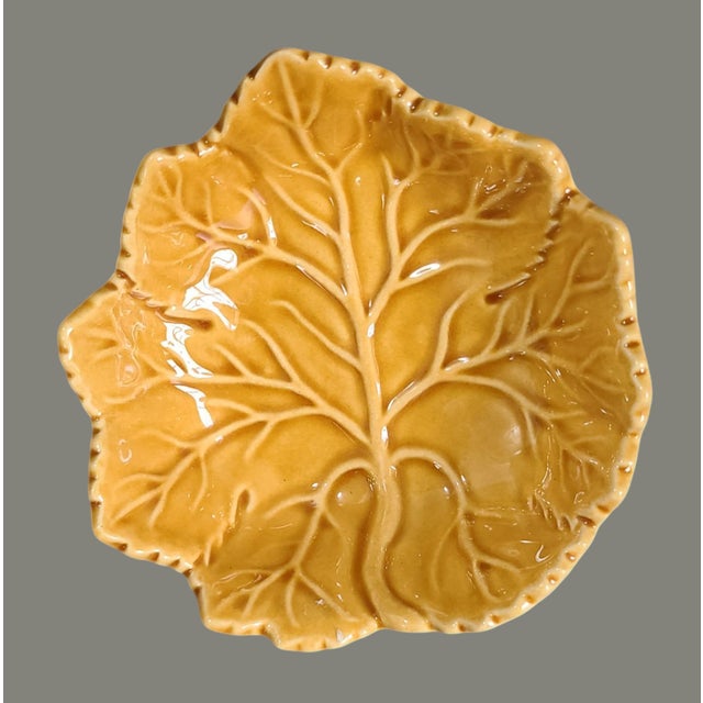 Crafted with precision, this pair of vintage Majolica pottery bowls exudes a timeless elegance. The rich amber hue,...