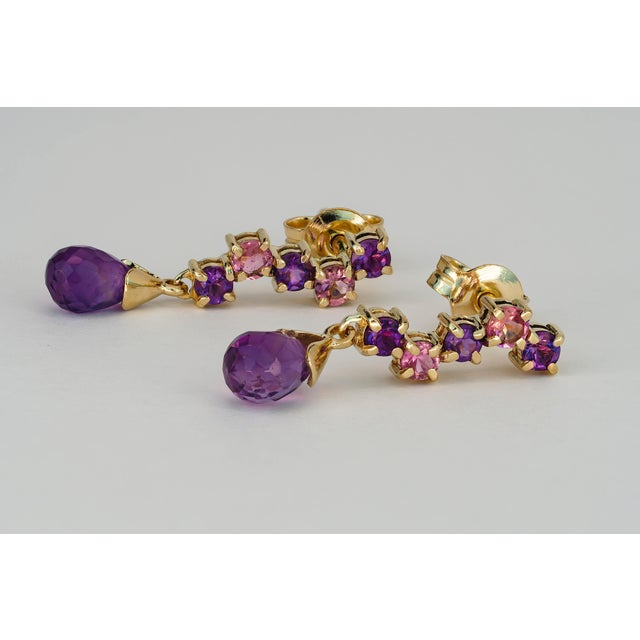 925 silver earrings with amethysts and sapphires. Metal: 925 yellow silver Total weight: 2.20 g. Size: 22 x 5 mm. Central...