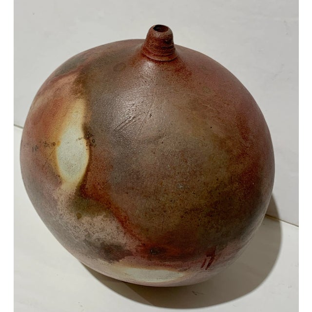 This is a beautiful hand crafted vase that would hold the perfect stem - perhaps it could also be used as an elegant oil...