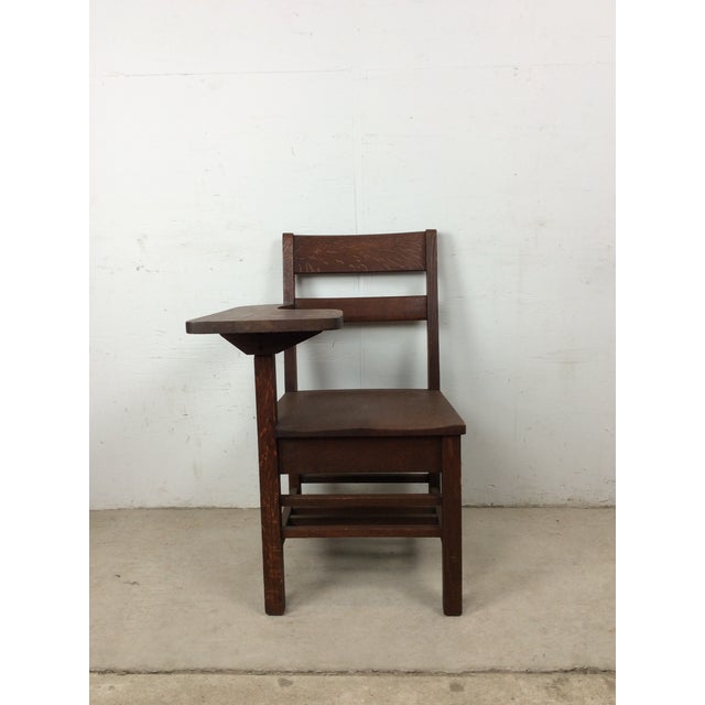 This antique child's school desk features hardwood construction, solid oak with original dark finish, writing surface, and...