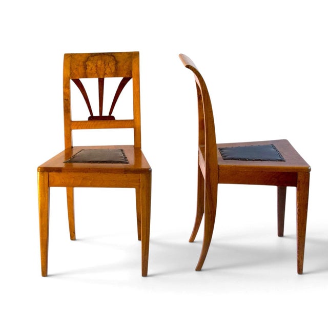 A set of four antique Austrian Empire walnut chairs, early 19thC These chairs have been used in Soviet /Russian embassy in...