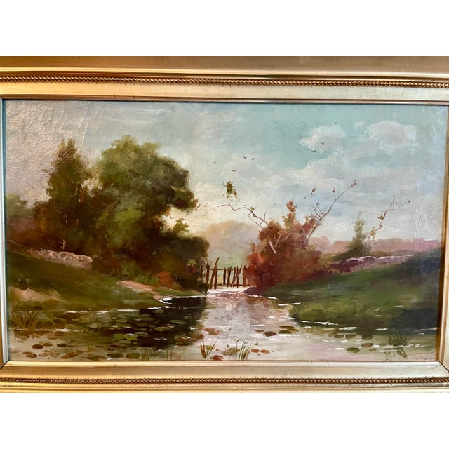 Antique 19th century landscape oil painting on canvas. Beautiful landscape with a stream. Deep gold frame approximately 28...