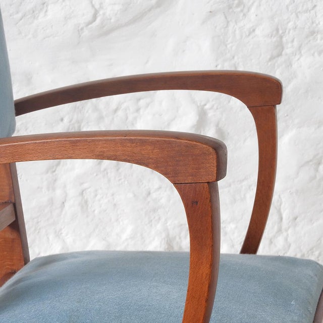 Solid oak frame with armrests, seat, and back upholstered in light blue fabric. Spring seat. France, 1940s Width: 55.5 cm...