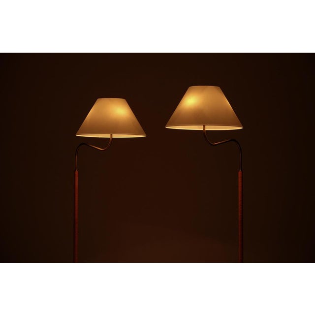 Designed by Josef Frank in 1939, this pair produced circa 1960s. New leather and new original Svenskt tenn lampshades....